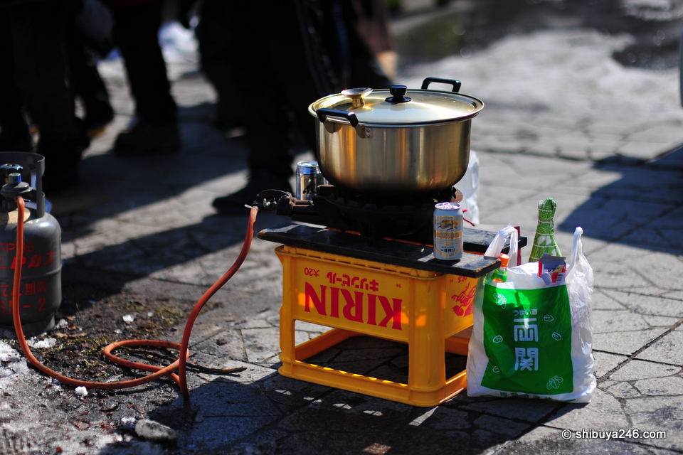 A portable gas bottle and a makeshift Nabe. Looks like the chefs might have had a few drinks too.