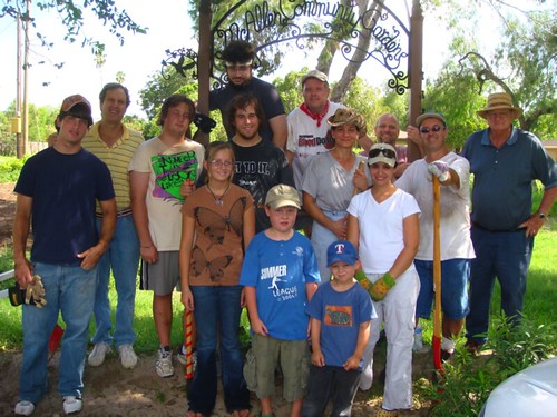 McAllen Community Gardeners. This photo shows some of the gardeners aged 8 to 80+. The gardeners have just finished spreading manure and compost on the garden. 