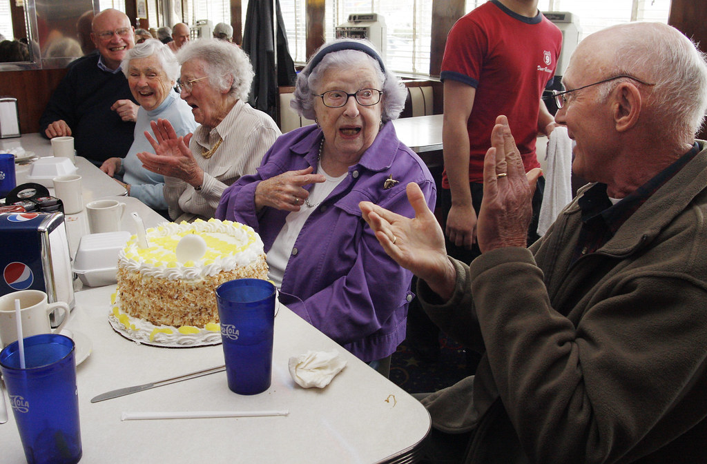 April 13, 2010 - Annette O'Leary's friends clap after she (with a little help) blows out the candles on her cake at the Route 9 Diner. O'Leary's 97th birthday was in January of this year. She is a retired teacher of Northampton and meets with her teacher friends on the 2nd tuesday of every month for breakfast, today it was lunch and a birthday celebration. Sitting next to her are Wally Brown (right) and on her other side is Andrea Uhlig, Ruth Barton and Bill Johnson.