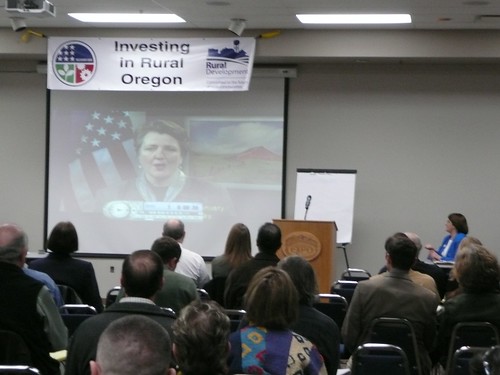  Participants at a Jobs Forum in Albany, Oregon watch a video presentation featuring Agriculture Deputy Secretary Merrigan