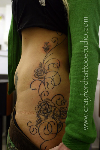 Roses and swirls Tattoo by The Tattoo Studio
