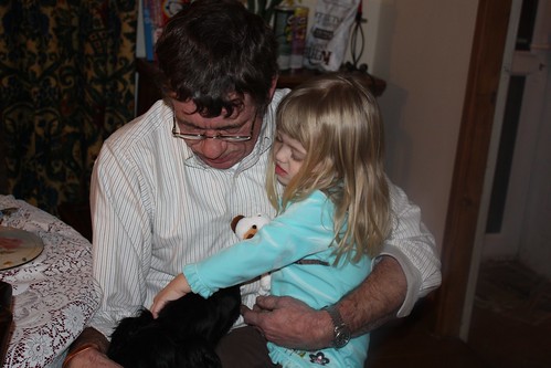 Grandpa Roger & Catie petting Zack the puppy