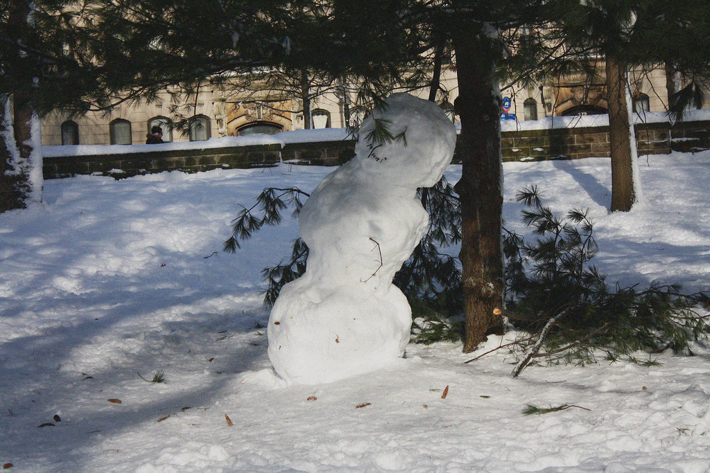 snowman under tree