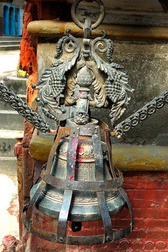 Ornate cast metal offering bell, custom cover and chain, downtown Kathmandu, Nepal by Wonderlane