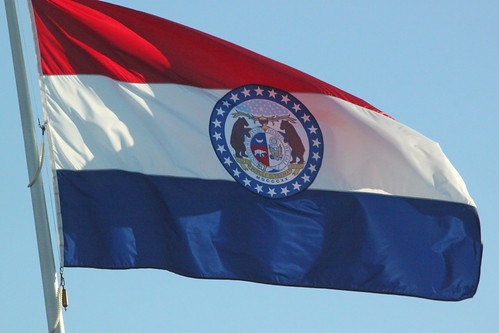 state of missouri flag. The flag of the state of Missouri, USA. The flag consists of three horizontal stripes of red, white and blue. These represent valor, purity, vigilance,