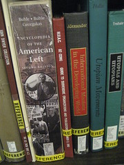 Reference books on a shelf.