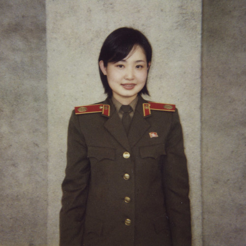 north korean army uniform. She is dressed in uniform but