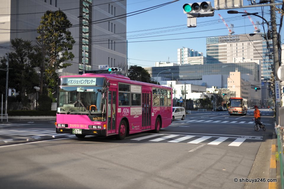 Bright pink bus taking people to the Aeon Jusco store at Shinagawa Seaside.