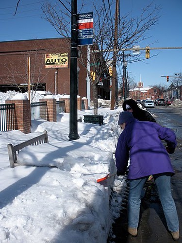 Tina Slater and Kathy Jentz, clearing out the stop on Fenton near Thayer, downtown Silver Spring.