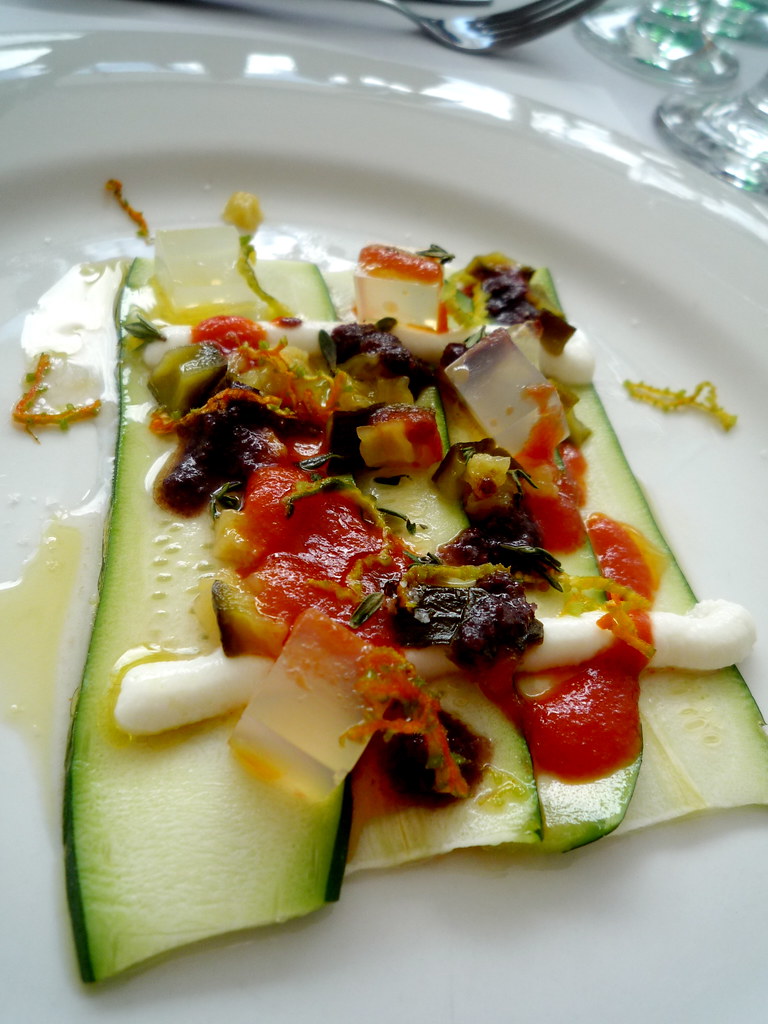 Raw zucchini, goats curd, zucchini confiture, paremesan gel, olive and tomato sauces, thyme