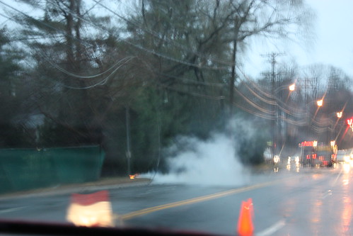 Apologies for the blurriness: a downed power line ignites a fire.