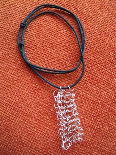 Knitted silver pendant