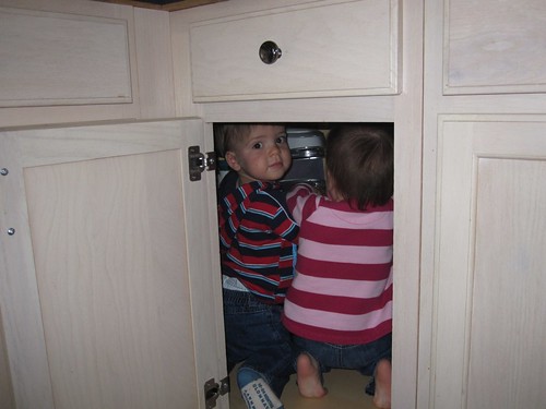 Ethan and Emma crawled in the cabinet - 2