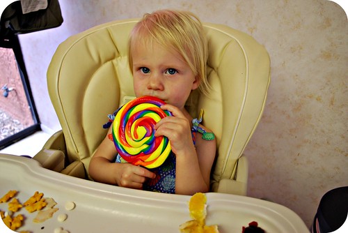 my little goddaughter and a lollipop from Uncle Hank!