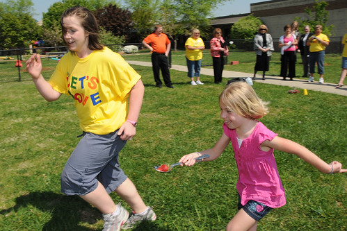 Physical Education Teacher Mandy Davis runs with a Thomasville Primary School student in the “strawberry in a spoon race” as part of their Let’s Move program inspired by First Lady Michelle Obama. The school received a USDA HealthierUS School Challenge Gold Award. (USDA photo by Debbie Haston-Hilger) 
