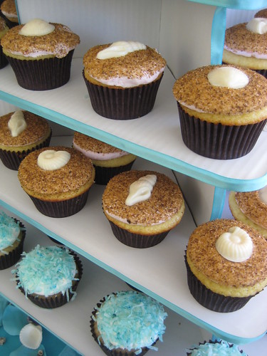 Pina Colada cupcakes topped with tiffany blue tinted coconut