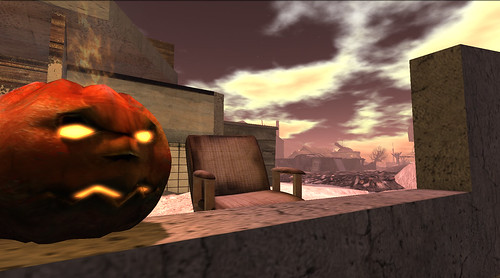 A lone jack-o-lantern peers out from the Motel 666 offiss