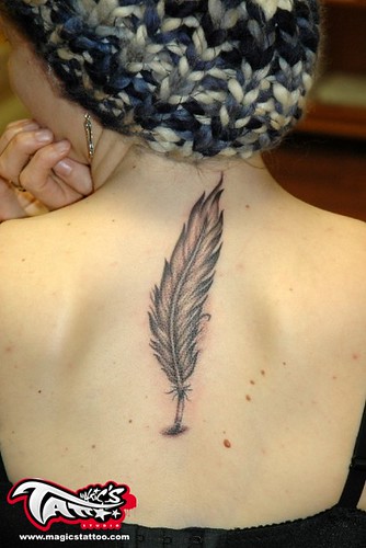 feather tattoo. feather tattoo on back