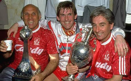 Ronnie Moran (left), manager Kenny Dalglish and assistant manager Roy Evans enjoy the club's 18th championship title