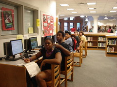 Students using computers before school. by TDHS Library