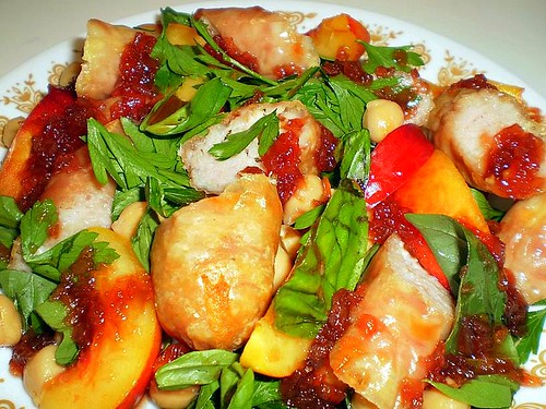 Chicken sausages with nectarines, chickpeas and redcurrant sauce