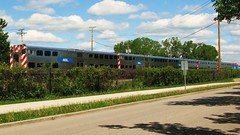 Southbound Metra local departing from the Glen of North Glenview Metra commuter rail station. Glenview Illinois. Thursday, May 6th 2010.