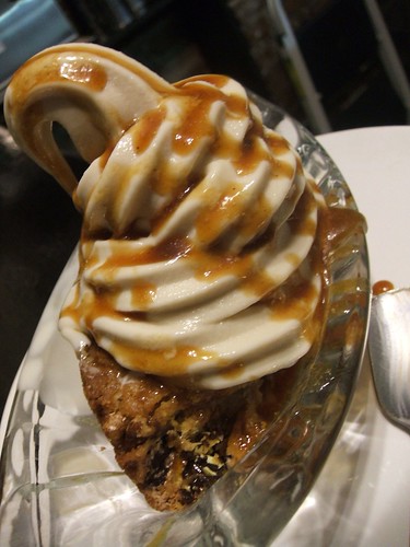 vegan 'm&ms' blondie with cakebatter softserve and caramel sauce.