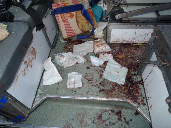 Blood spilling all over the rear area of the medic van due to massive loss of blood