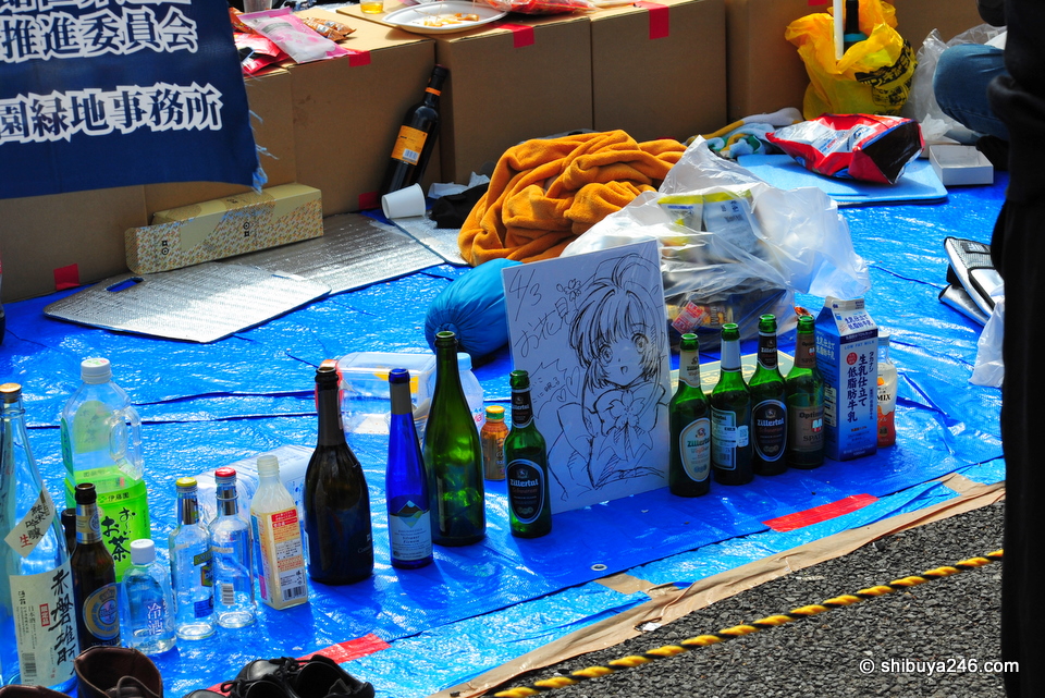 The empty bottles are lined up, the drawings left behind. These guys are probably restocking and will be back soon.