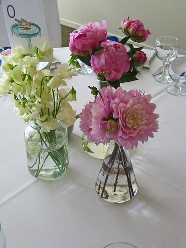 The centerpieces were stems in lab glass With custom made science flashcard