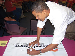 In Iowa during the 2008 presidential campaign, candidate Barack Obama showed his support for high speed broadband by signing CWA's Speed Matters bannner.