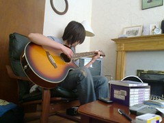 Jara playing guitar