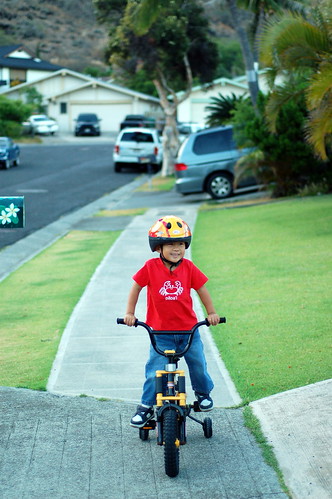 Owen riding his bicycle to go watch the Tinman Triathlon bicycle segment