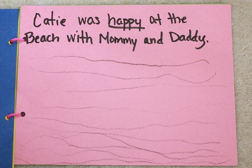 "Catie was happy at the beach with Mommy and Daddy"