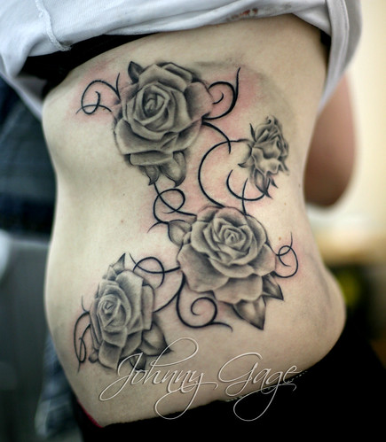 roses with vines on side tattoo