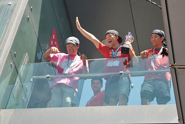 Korean boyband members waving