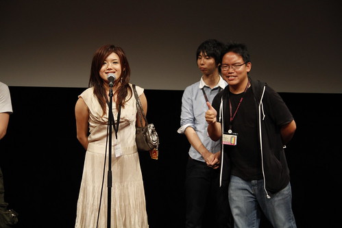 Director Lisa Takeba giving a speech (while I pose)