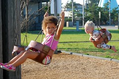Duo of Swinging Children