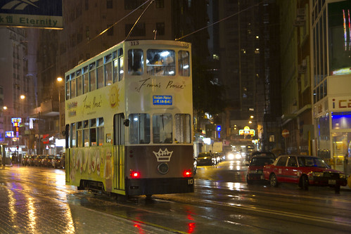 Bus at rain-drenched street of Hong Kong