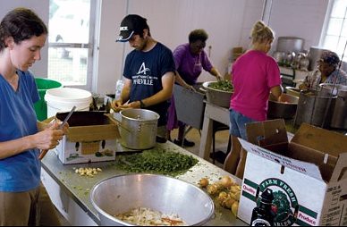 Community canning.  Lee O'Neill and others process vegetables at the Keezletown (Va.) Community Cannery, which has supported food preservation since 1942.