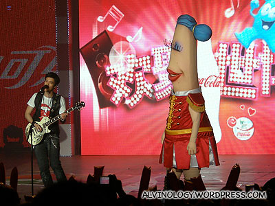 One of the mascots looking adorningly at Lee Hom