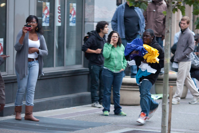 Looter Runs Down Broadway With Items Taken From Foot Locker, Oakland Riots, 2010