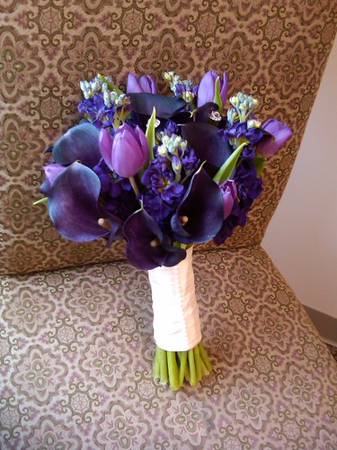 Bridal bouquet of purple calla lilies tulips and stock blossoms