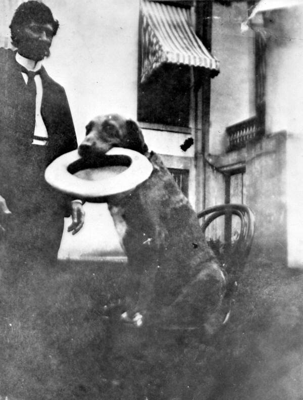 Florida Secretary of State H. Clay Crawford with dog in front of the state capitol: Tallahassee, Florida