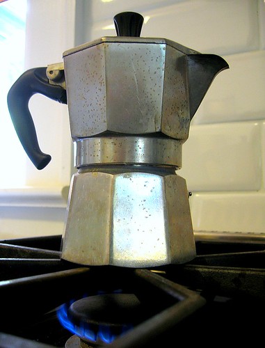 Stovetop espresso or moka pot gently simmering 