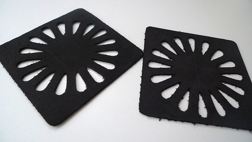 black coasters with flower