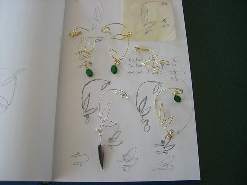 Several feather/leaf ear cuffs, all slightly different