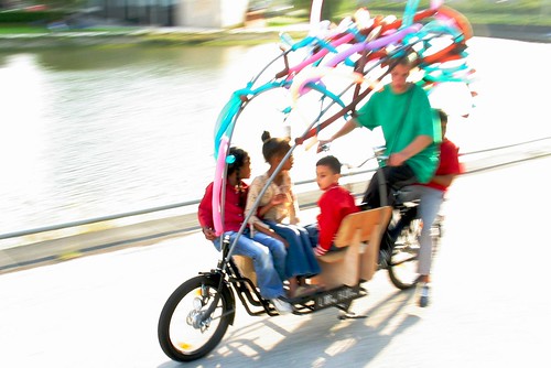 five kids on a long john bike