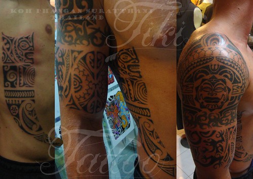 tiki tattoos. hand at Tiki Tattoo studio