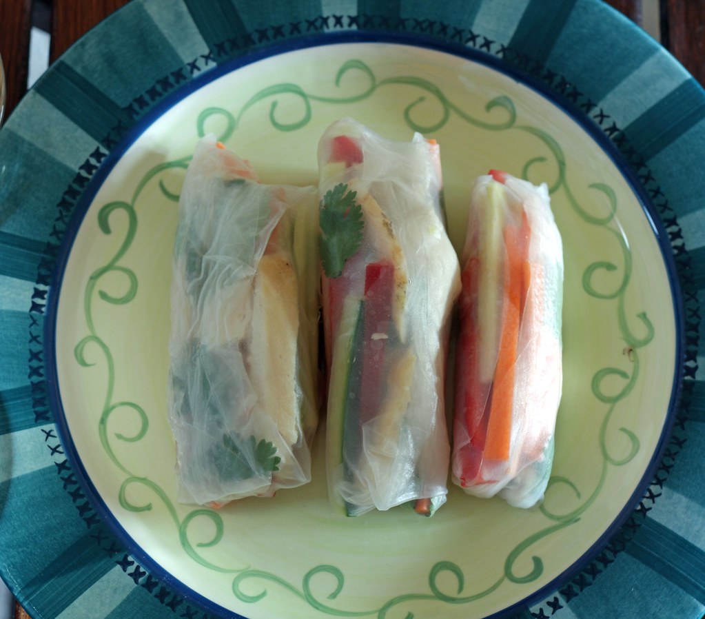 plate of summer rolls and sauces